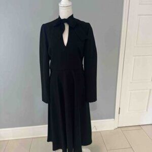 Long-Sleeved Black Midi Dress with Keyhole Neckline and Bow Collar